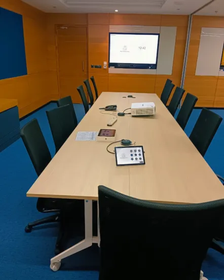 Modern meeting room with AV integration including display and video conferencing equipment