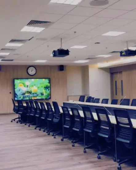 Corporate office conference room AV setup with professional video conferencing system and displays