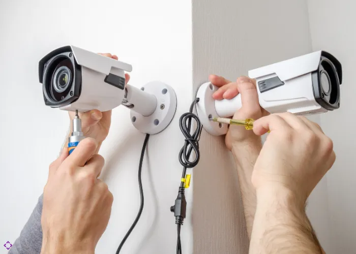 CCTV cameras being mounted on wall for security surveillance installation