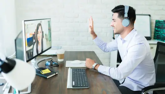 Business team in a meeting room using video conferencing system for unified communication and remote collaboration