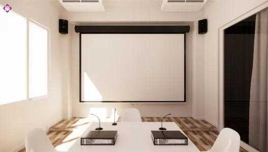 Conference boardroom featuring video conferencing equipment, ceiling speakers, and projection screen.
